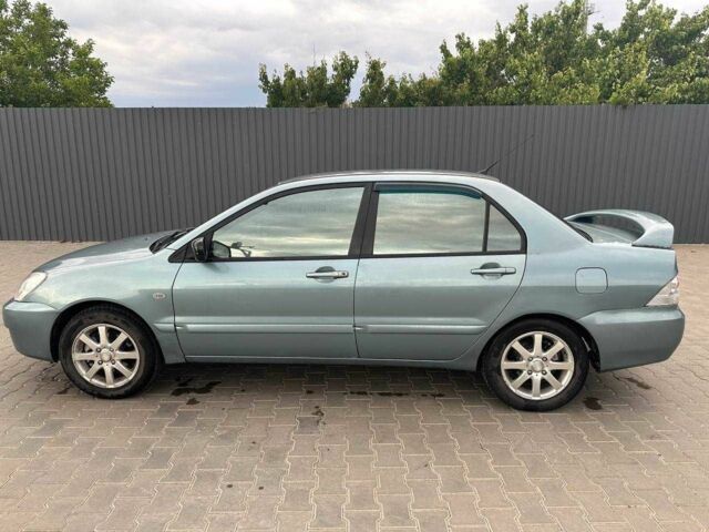 Зеленый Мицубиси Лансер, объемом двигателя 1.6 л и пробегом 300 тыс. км за 3800 $, фото 5 на Automoto.ua