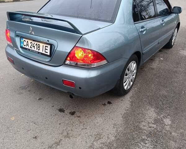 Зелений Міцубісі Lancer, об'ємом двигуна 1.6 л та пробігом 162 тис. км за 4700 $, фото 6 на Automoto.ua