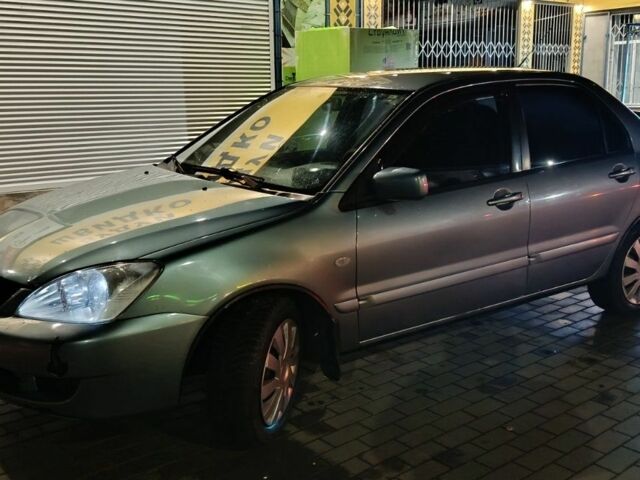 Зелений Міцубісі Lancer, об'ємом двигуна 1.6 л та пробігом 203 тис. км за 3700 $, фото 1 на Automoto.ua