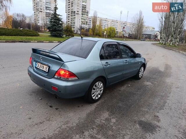 Зелений Міцубісі Lancer, об'ємом двигуна 1.6 л та пробігом 162 тис. км за 4700 $, фото 1 на Automoto.ua