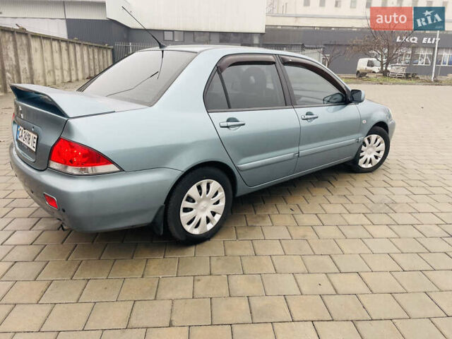 Зеленый Мицубиси Лансер, объемом двигателя 1.6 л и пробегом 164 тыс. км за 5000 $, фото 3 на Automoto.ua