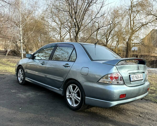 Зелений Міцубісі Lancer, об'ємом двигуна 2 л та пробігом 225 тис. км за 5599 $, фото 5 на Automoto.ua