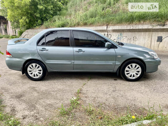 Зелений Міцубісі Lancer, об'ємом двигуна 1.6 л та пробігом 220 тис. км за 4750 $, фото 8 на Automoto.ua