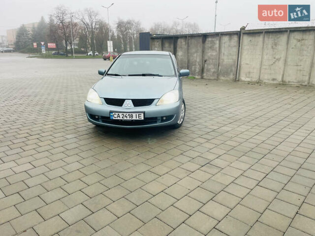 Зеленый Мицубиси Лансер, объемом двигателя 1.6 л и пробегом 164 тыс. км за 5000 $, фото 5 на Automoto.ua