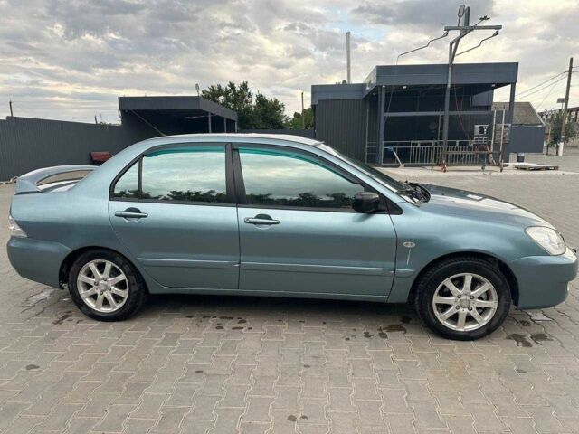 Зеленый Мицубиси Лансер, объемом двигателя 1.6 л и пробегом 300 тыс. км за 3800 $, фото 4 на Automoto.ua