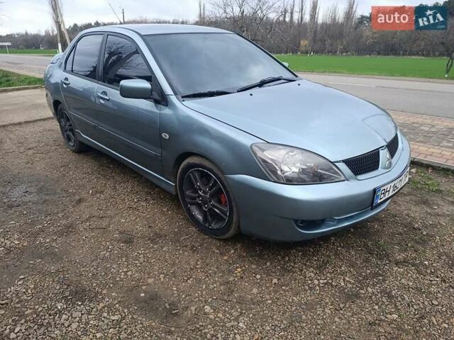 Зелений Міцубісі Lancer, об'ємом двигуна 2 л та пробігом 238 тис. км за 2999 $, фото 1 на Automoto.ua