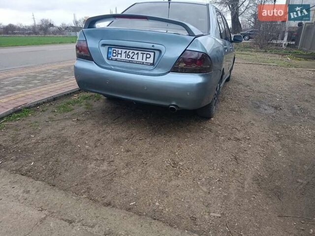 Зелений Міцубісі Lancer, об'ємом двигуна 2 л та пробігом 238 тис. км за 2999 $, фото 5 на Automoto.ua
