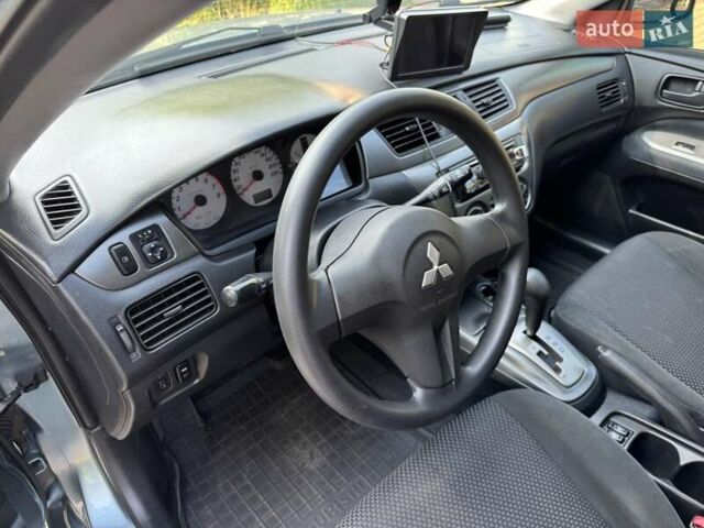 Зеленый Мицубиси Лансер, объемом двигателя 1.6 л и пробегом 137 тыс. км за 5500 $, фото 25 на Automoto.ua