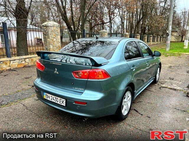 Зеленый Мицубиси Лансер, объемом двигателя 2 л и пробегом 128 тыс. км за 5777 $, фото 11 на Automoto.ua