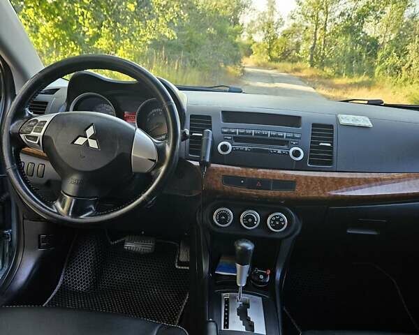 Зелений Міцубісі Lancer, об'ємом двигуна 1.47 л та пробігом 215 тис. км за 5000 $, фото 16 на Automoto.ua