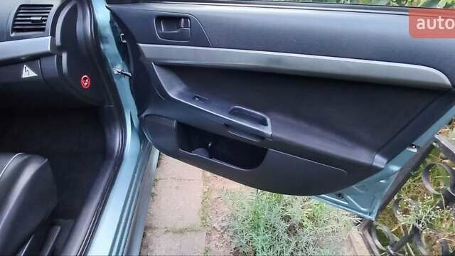 Зелений Міцубісі Lancer, об'ємом двигуна 2 л та пробігом 265 тис. км за 5100 $, фото 15 на Automoto.ua
