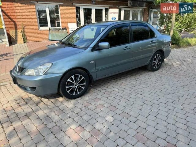 Зеленый Мицубиси Лансер, объемом двигателя 1.6 л и пробегом 137 тыс. км за 5500 $, фото 4 на Automoto.ua