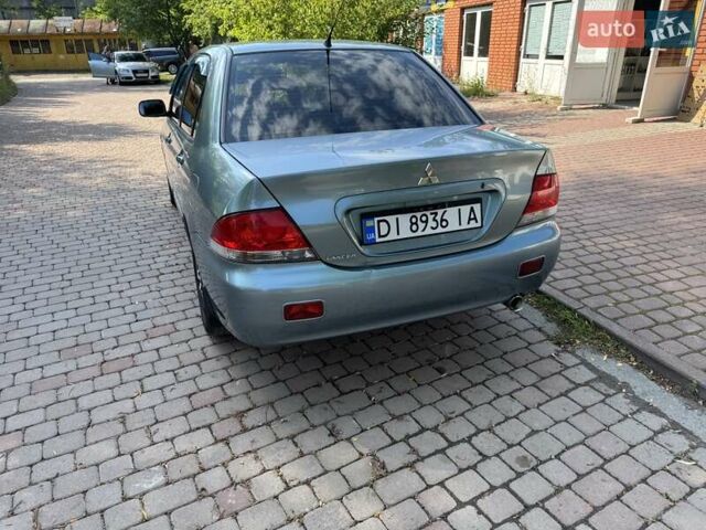 Зеленый Мицубиси Лансер, объемом двигателя 1.6 л и пробегом 137 тыс. км за 5500 $, фото 7 на Automoto.ua