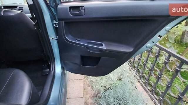 Зелений Міцубісі Lancer, об'ємом двигуна 2 л та пробігом 265 тис. км за 5100 $, фото 17 на Automoto.ua