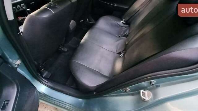 Зелений Міцубісі Lancer, об'ємом двигуна 2 л та пробігом 265 тис. км за 5100 $, фото 14 на Automoto.ua