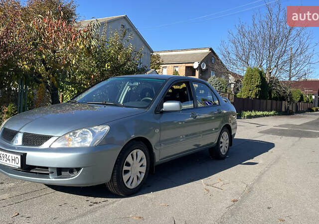 Зеленый Мицубиси Лансер, объемом двигателя 1.58 л и пробегом 180 тыс. км за 4800 $, фото 2 на Automoto.ua