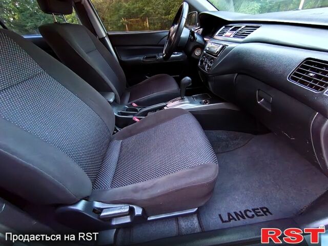 Зеленый Мицубиси Лансер, объемом двигателя 1.6 л и пробегом 187 тыс. км за 4999 $, фото 6 на Automoto.ua