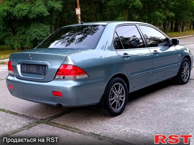 Зеленый Мицубиси Лансер, объемом двигателя 1.6 л и пробегом 187 тыс. км за 4999 $, фото 2 на Automoto.ua