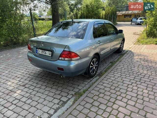 Зеленый Мицубиси Лансер, объемом двигателя 1.6 л и пробегом 137 тыс. км за 5500 $, фото 9 на Automoto.ua