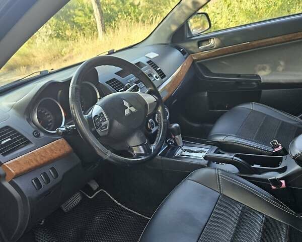 Зелений Міцубісі Lancer, об'ємом двигуна 1.47 л та пробігом 215 тис. км за 5000 $, фото 19 на Automoto.ua