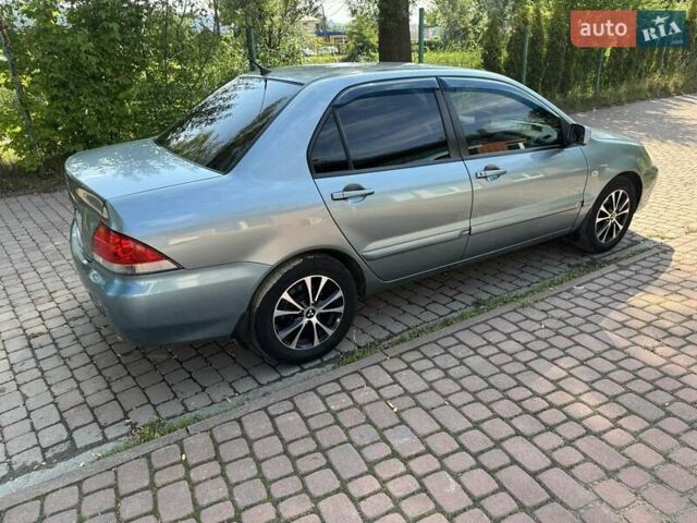 Зеленый Мицубиси Лансер, объемом двигателя 1.6 л и пробегом 137 тыс. км за 5500 $, фото 10 на Automoto.ua