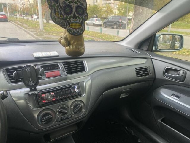 Зеленый Мицубиси Лансер, объемом двигателя 1.6 л и пробегом 167 тыс. км за 3500 $, фото 8 на Automoto.ua