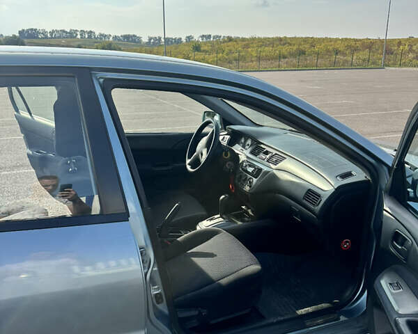 Зелений Міцубісі Lancer, об'ємом двигуна 1.58 л та пробігом 255 тис. км за 3700 $, фото 8 на Automoto.ua