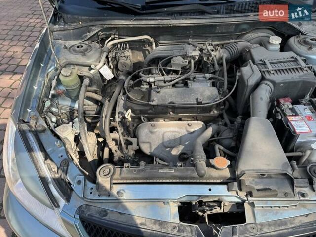 Зеленый Мицубиси Лансер, объемом двигателя 1.6 л и пробегом 137 тыс. км за 5500 $, фото 26 на Automoto.ua