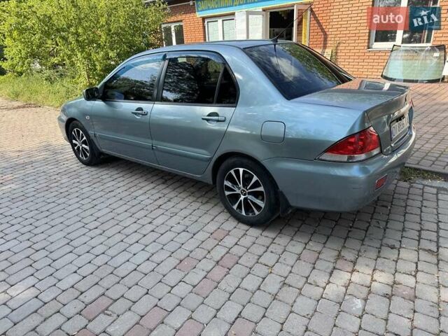 Зеленый Мицубиси Лансер, объемом двигателя 1.6 л и пробегом 137 тыс. км за 5500 $, фото 6 на Automoto.ua