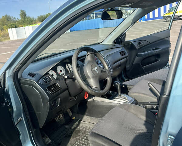 Зелений Міцубісі Lancer, об'ємом двигуна 1.58 л та пробігом 255 тис. км за 3700 $, фото 9 на Automoto.ua