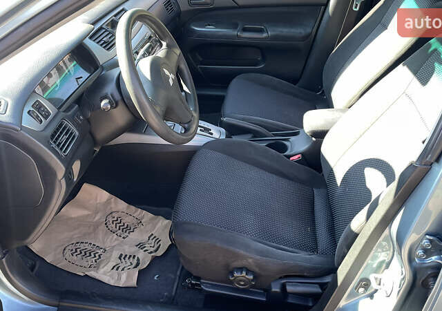 Зеленый Мицубиси Лансер, объемом двигателя 1.58 л и пробегом 180 тыс. км за 4800 $, фото 8 на Automoto.ua