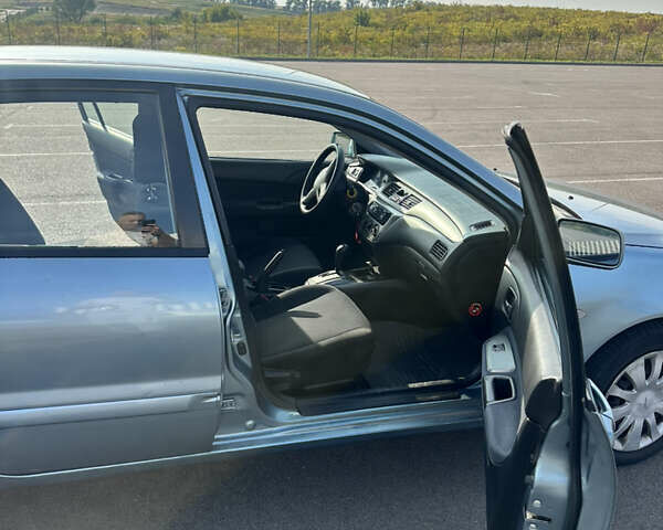 Зелений Міцубісі Lancer, об'ємом двигуна 1.58 л та пробігом 255 тис. км за 3700 $, фото 7 на Automoto.ua