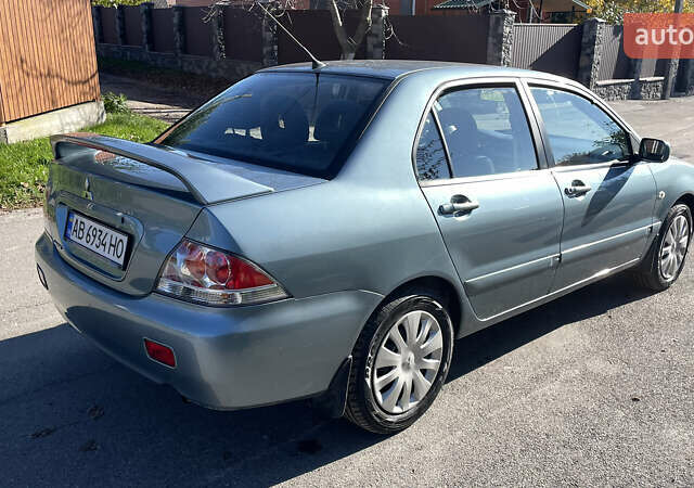 Зеленый Мицубиси Лансер, объемом двигателя 1.58 л и пробегом 180 тыс. км за 4800 $, фото 5 на Automoto.ua