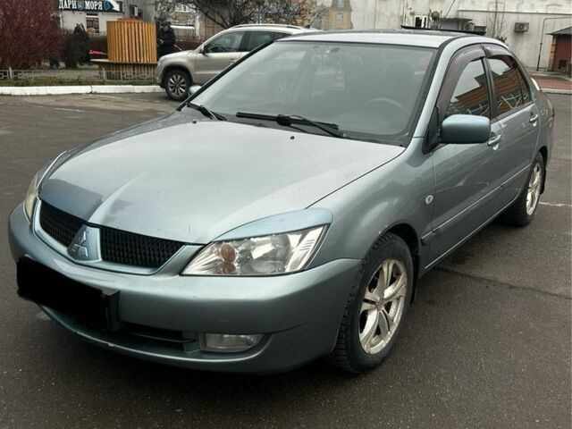 Зеленый Мицубиси Лансер, объемом двигателя 1.6 л и пробегом 234 тыс. км за 5300 $, фото 2 на Automoto.ua