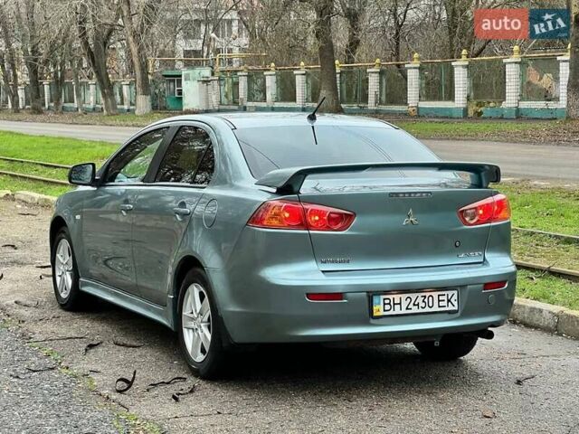 Зелений Міцубісі Lancer, об'ємом двигуна 2 л та пробігом 135 тис. км за 5700 $, фото 12 на Automoto.ua