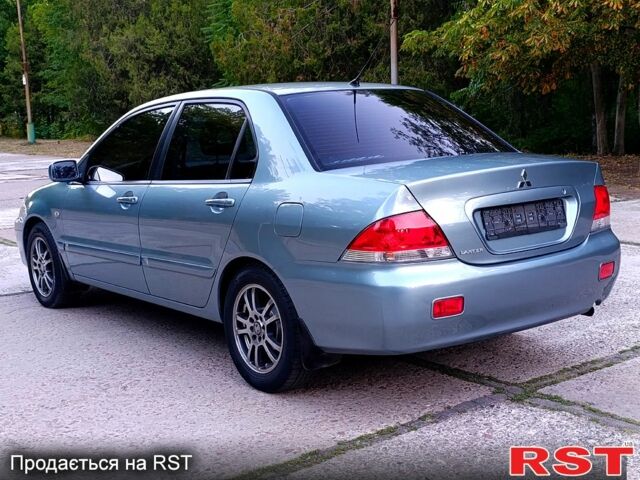 Зеленый Мицубиси Лансер, объемом двигателя 1.6 л и пробегом 187 тыс. км за 4999 $, фото 3 на Automoto.ua