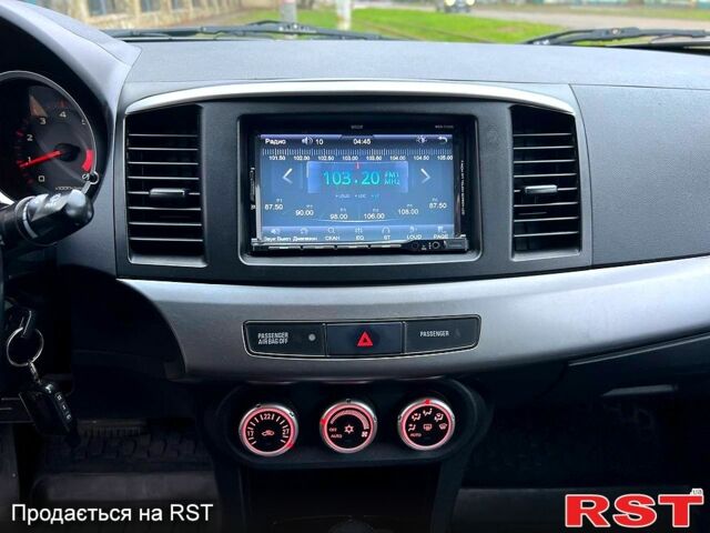 Зеленый Мицубиси Лансер, объемом двигателя 2 л и пробегом 128 тыс. км за 5777 $, фото 9 на Automoto.ua