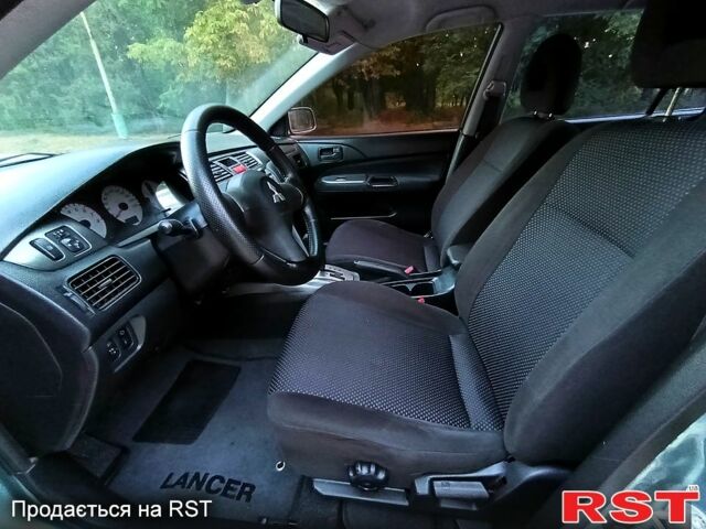 Зеленый Мицубиси Лансер, объемом двигателя 1.6 л и пробегом 187 тыс. км за 4999 $, фото 5 на Automoto.ua