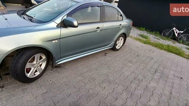 Зелений Міцубісі Lancer, об'ємом двигуна 2 л та пробігом 265 тис. км за 5100 $, фото 6 на Automoto.ua