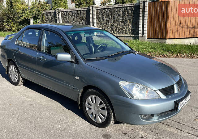 Зеленый Мицубиси Лансер, объемом двигателя 1.58 л и пробегом 180 тыс. км за 4800 $, фото 1 на Automoto.ua