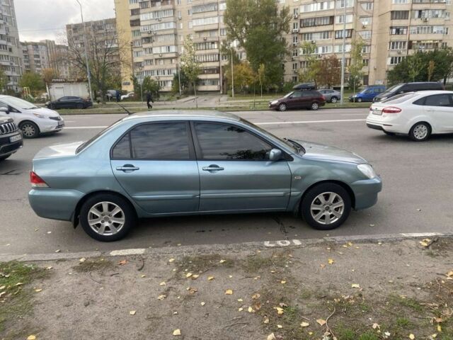 Зеленый Мицубиси Лансер, объемом двигателя 1.6 л и пробегом 167 тыс. км за 3500 $, фото 4 на Automoto.ua