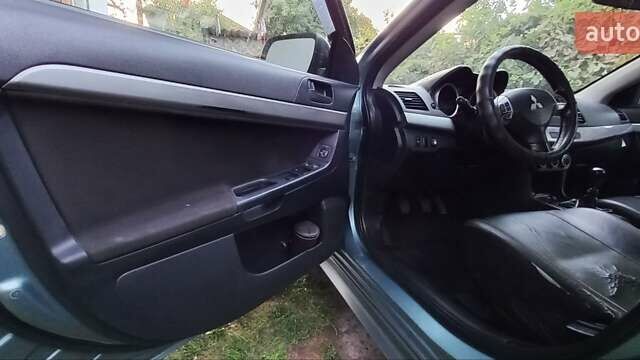 Зелений Міцубісі Lancer, об'ємом двигуна 2 л та пробігом 265 тис. км за 5100 $, фото 11 на Automoto.ua