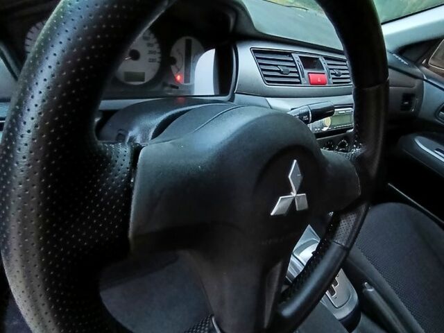 Зеленый Мицубиси Лансер, объемом двигателя 1.6 л и пробегом 187 тыс. км за 4999 $, фото 8 на Automoto.ua