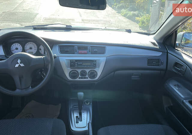 Зеленый Мицубиси Лансер, объемом двигателя 1.58 л и пробегом 180 тыс. км за 4800 $, фото 6 на Automoto.ua