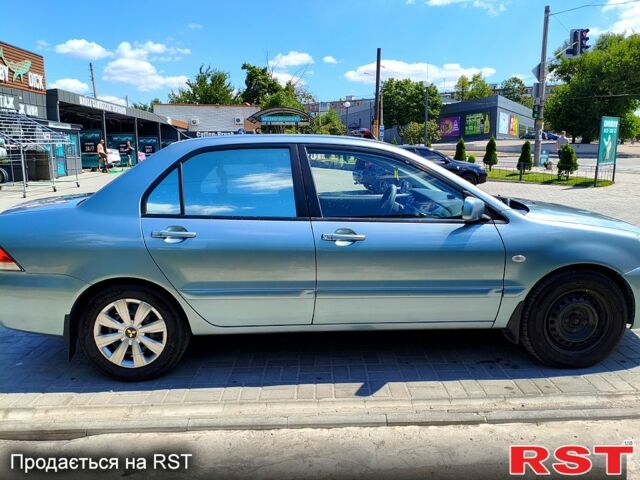 Зеленый Мицубиси Лансер, объемом двигателя 1.6 л и пробегом 250 тыс. км за 5200 $, фото 3 на Automoto.ua