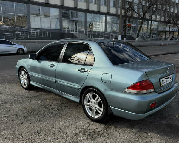 Зелений Міцубісі Lancer, об'ємом двигуна 1.6 л та пробігом 164 тис. км за 6000 $, фото 1 на Automoto.ua