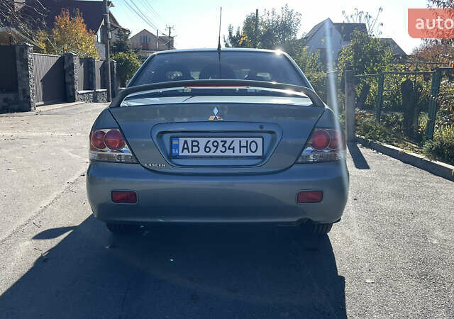 Зеленый Мицубиси Лансер, объемом двигателя 1.58 л и пробегом 180 тыс. км за 4800 $, фото 4 на Automoto.ua