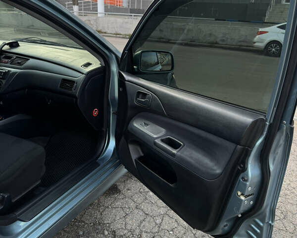Зелений Міцубісі Lancer, об'ємом двигуна 1.6 л та пробігом 164 тис. км за 6000 $, фото 11 на Automoto.ua