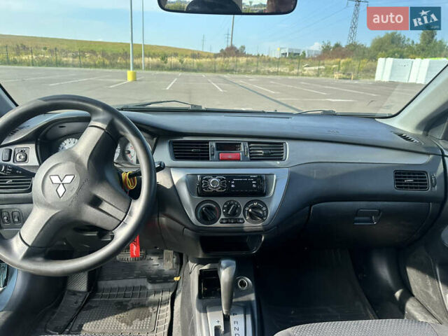 Зелений Міцубісі Lancer, об'ємом двигуна 1.58 л та пробігом 255 тис. км за 3700 $, фото 10 на Automoto.ua