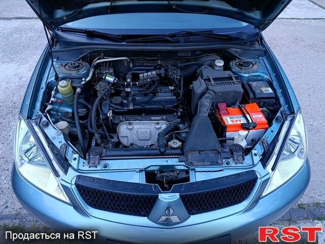 Зеленый Мицубиси Лансер, объемом двигателя 1.6 л и пробегом 187 тыс. км за 4999 $, фото 11 на Automoto.ua